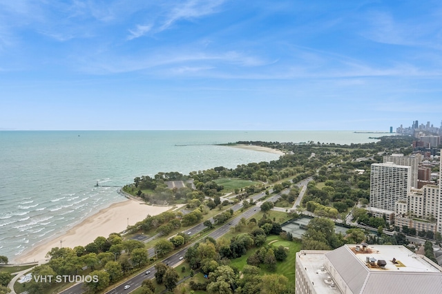 bird's eye view with a water view and a beach view