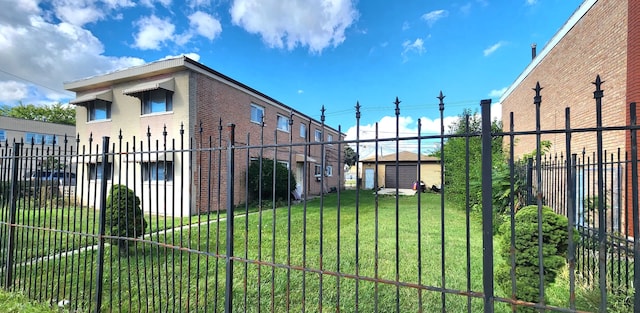 view of gate featuring a lawn