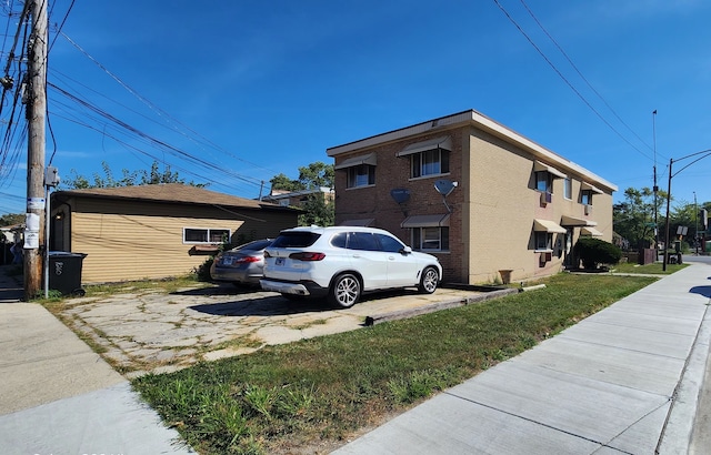 view of home's exterior featuring a lawn