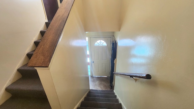 stairway featuring tile patterned flooring