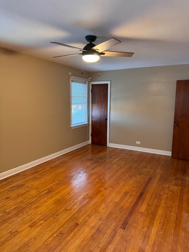 spare room featuring light wood-type flooring and ceiling fan