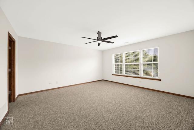 unfurnished room with ceiling fan and carpet floors