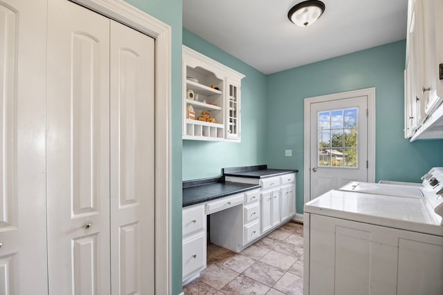 laundry room featuring independent washer and dryer and cabinets