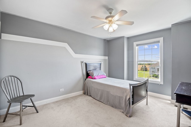 bedroom featuring ceiling fan and light colored carpet