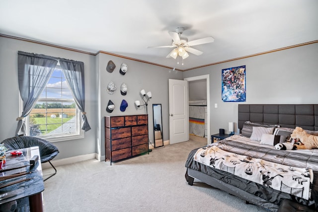 bedroom with light carpet, crown molding, and ceiling fan