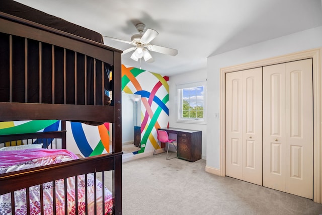 bedroom with a closet, light carpet, and ceiling fan