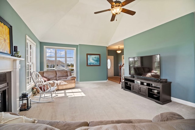 living room with light carpet, high vaulted ceiling, and ceiling fan