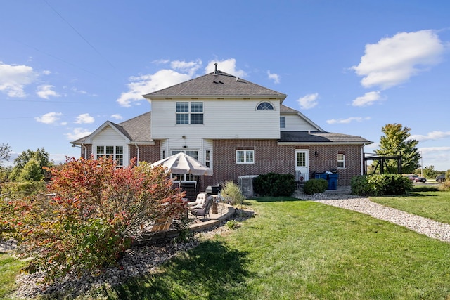 back of house featuring a yard