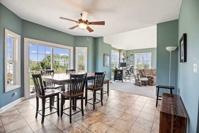 tiled dining area with ceiling fan