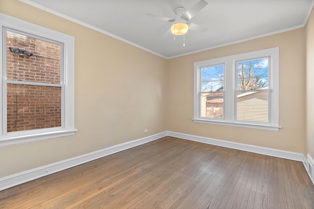 unfurnished room featuring wood-type flooring, crown molding, and ceiling fan