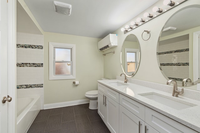 bathroom featuring an AC wall unit, toilet, and vanity