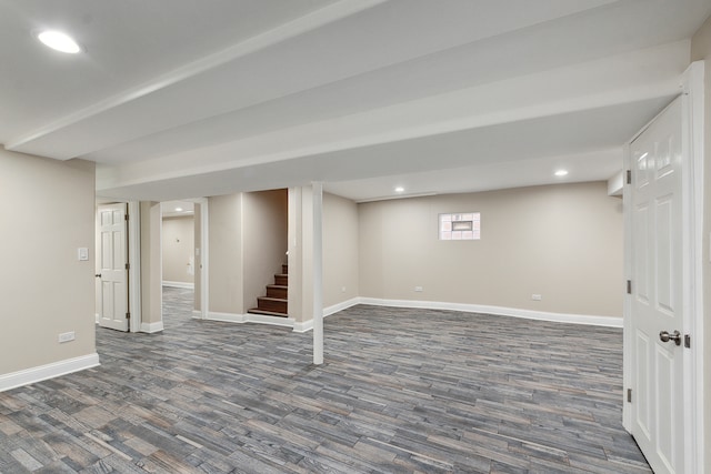 basement with dark hardwood / wood-style flooring