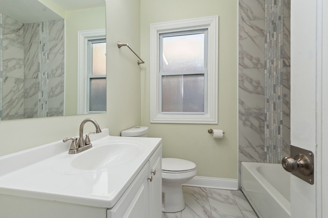 full bathroom with tiled shower / bath, vanity, and toilet