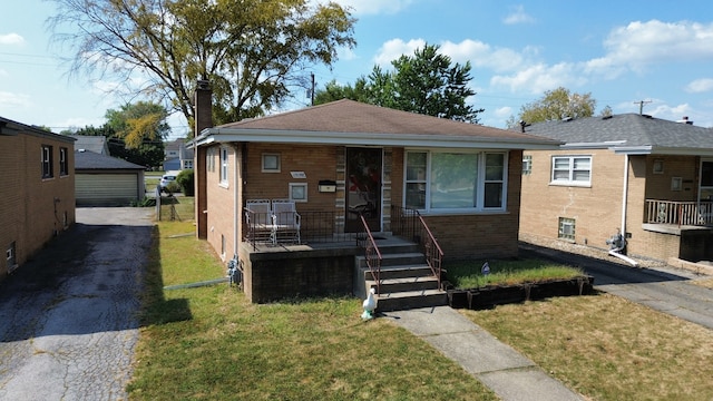 bungalow-style home featuring a front yard