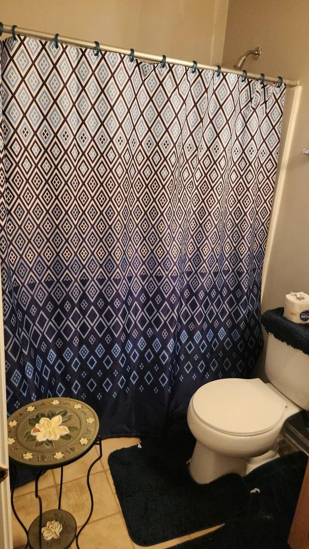 bathroom with tile patterned floors and toilet