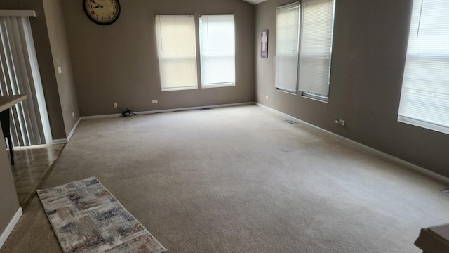 spare room with light colored carpet