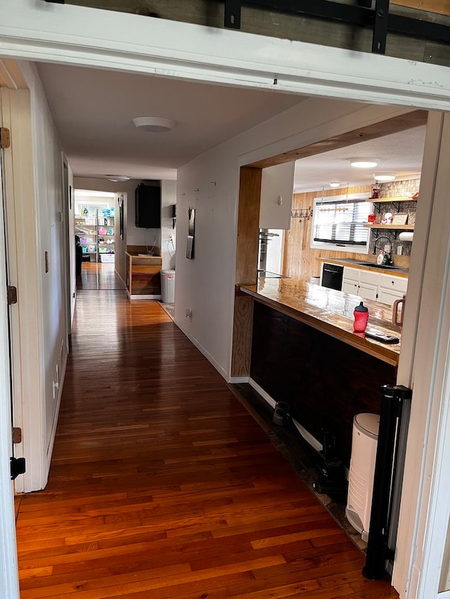 hallway featuring hardwood / wood-style flooring