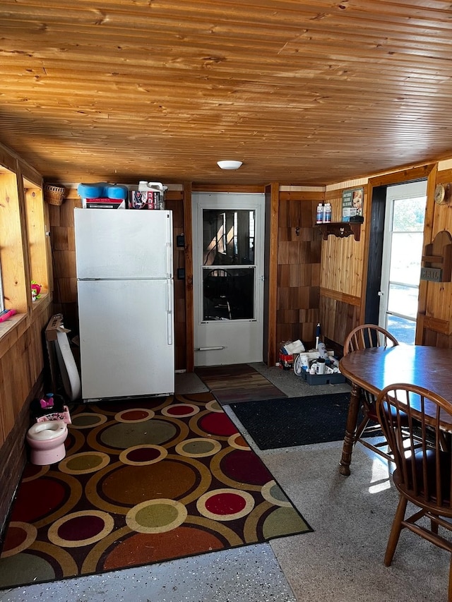 interior space with wood walls and wooden ceiling