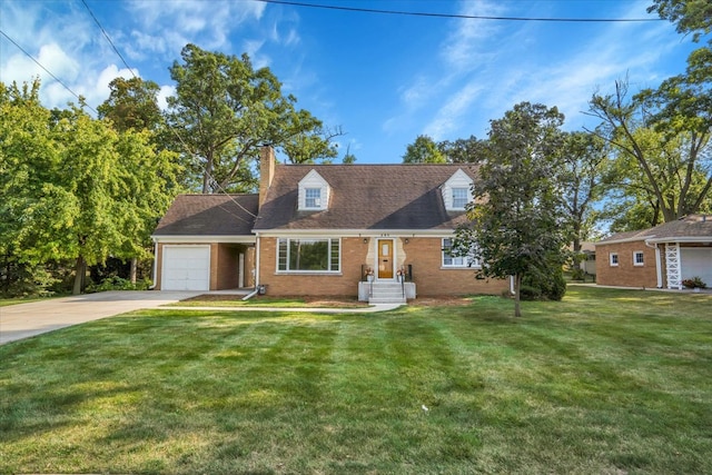 cape cod home with a front yard and a garage