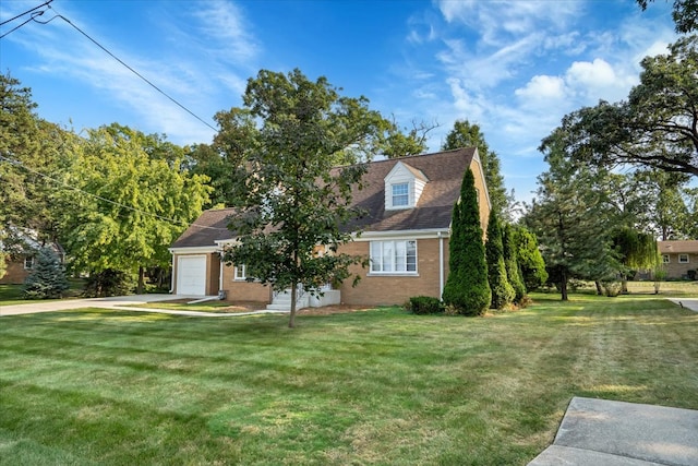 cape cod house with a garage and a front lawn