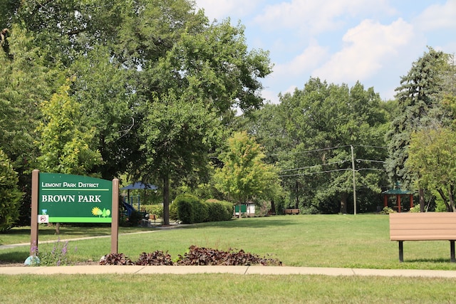 view of home's community with a lawn