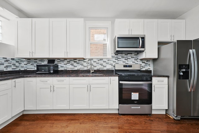 kitchen with white cabinets, sink, and appliances with stainless steel finishes