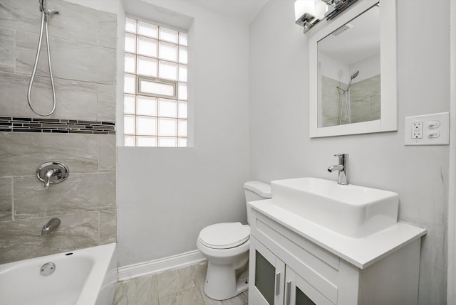 full bathroom with vanity, toilet, and tiled shower / bath combo