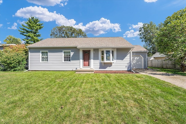 single story home featuring a front yard and a garage