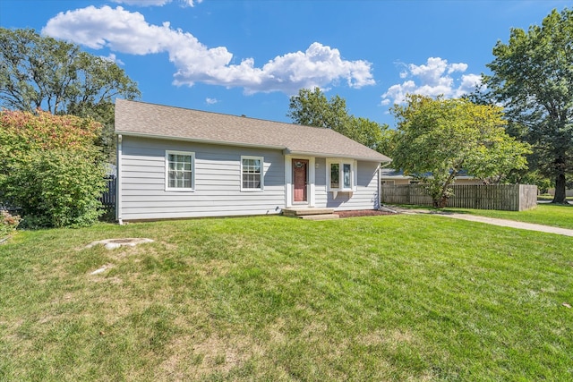 ranch-style home featuring a front yard