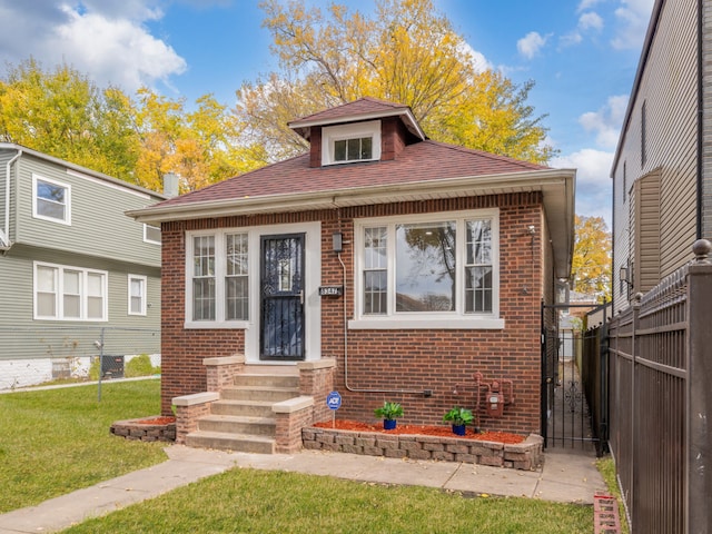 bungalow with a front yard