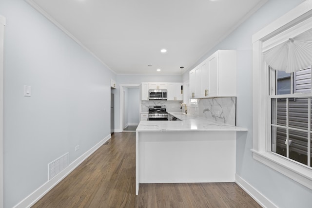 kitchen featuring decorative backsplash, kitchen peninsula, dark hardwood / wood-style flooring, stainless steel appliances, and white cabinets