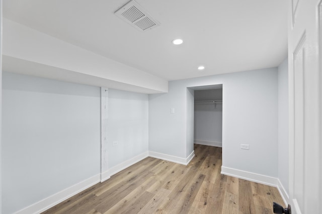 basement featuring light wood-type flooring