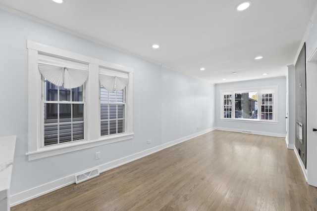 unfurnished living room featuring hardwood / wood-style flooring