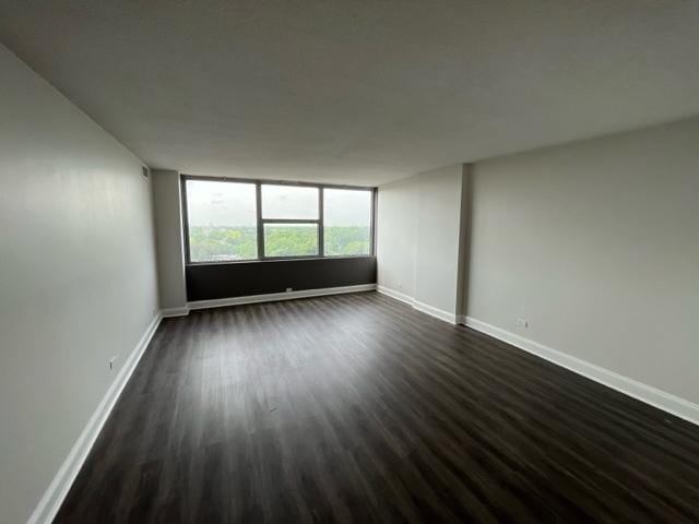 7234 W N Ave Unit 1109, Elmwood Park, IL 60707 - spare room with dark wood-type flooring and baseboards