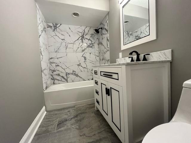 7234 W N Ave Unit 1109, Elmwood Park, IL 60707 - bathroom with vanity, marble finish floor, bathing tub / shower combination, toilet, and baseboards