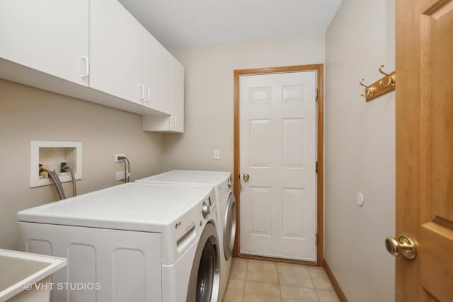 washroom featuring cabinets, separate washer and dryer, and sink