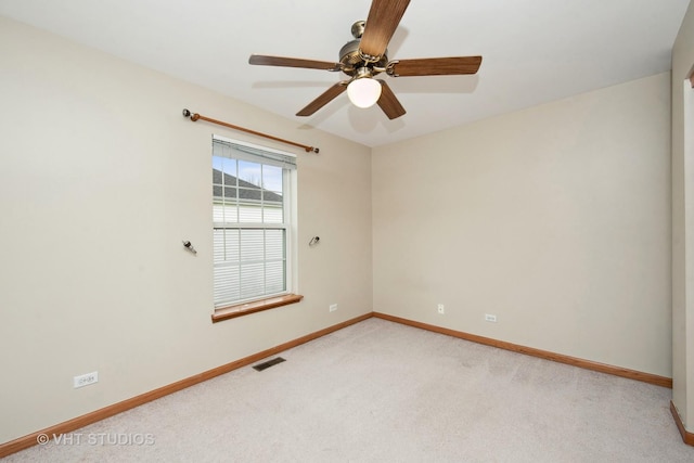 carpeted empty room featuring ceiling fan