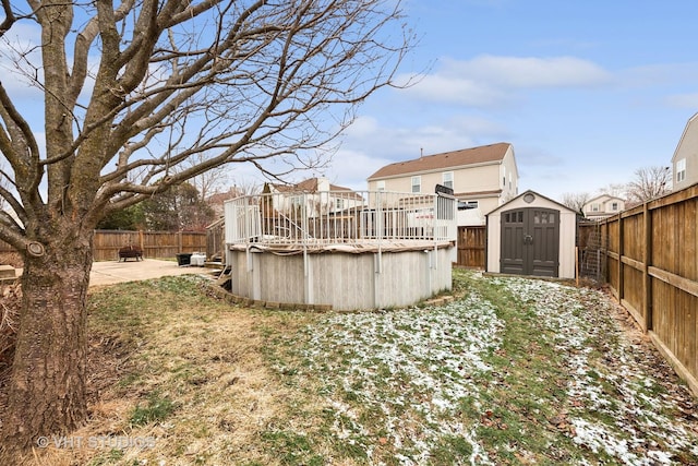 view of yard with a fenced in pool, a storage unit, and a patio area