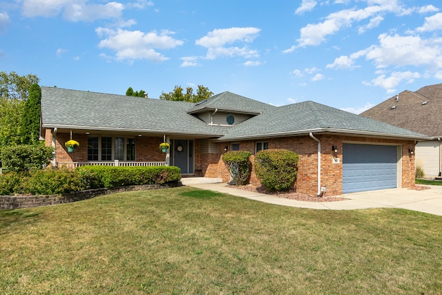 view of front of house with a garage, a front lawn, and a porch