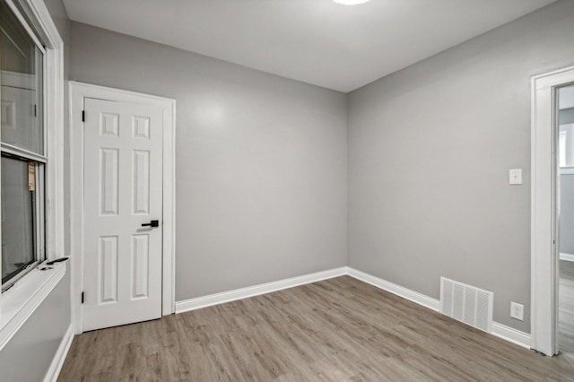 unfurnished room featuring light hardwood / wood-style flooring