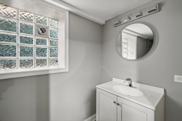 bathroom featuring vanity and a healthy amount of sunlight