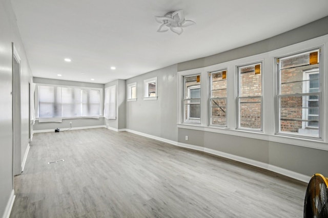 unfurnished living room featuring light wood-type flooring