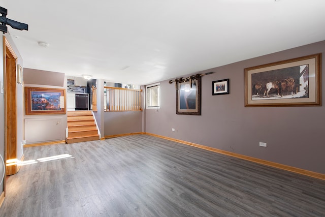 unfurnished living room featuring wood-type flooring