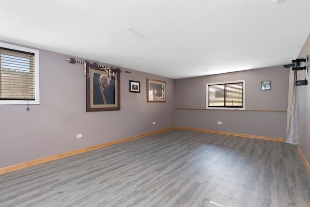 spare room with light hardwood / wood-style flooring and a healthy amount of sunlight