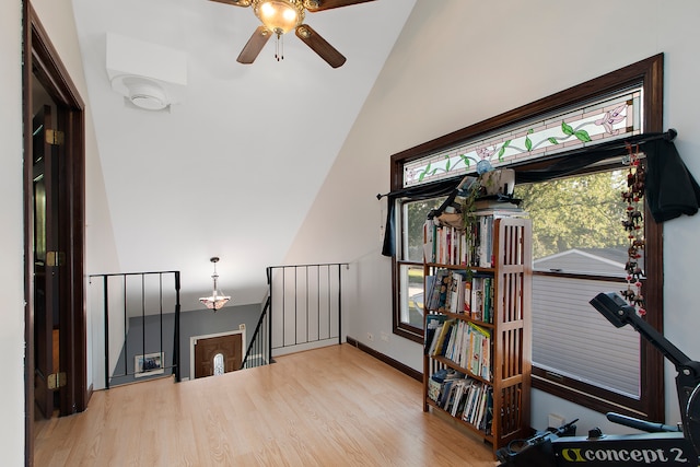 office space featuring ceiling fan, lofted ceiling, and light hardwood / wood-style floors