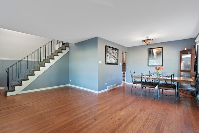 dining area with hardwood / wood-style flooring