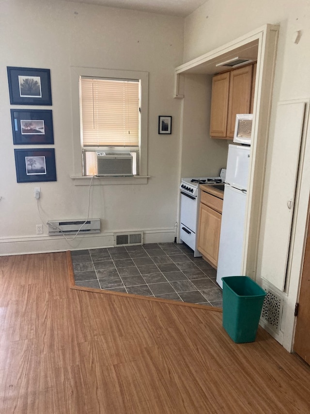 kitchen with white appliances, baseboard heating, dark hardwood / wood-style flooring, cooling unit, and light brown cabinetry