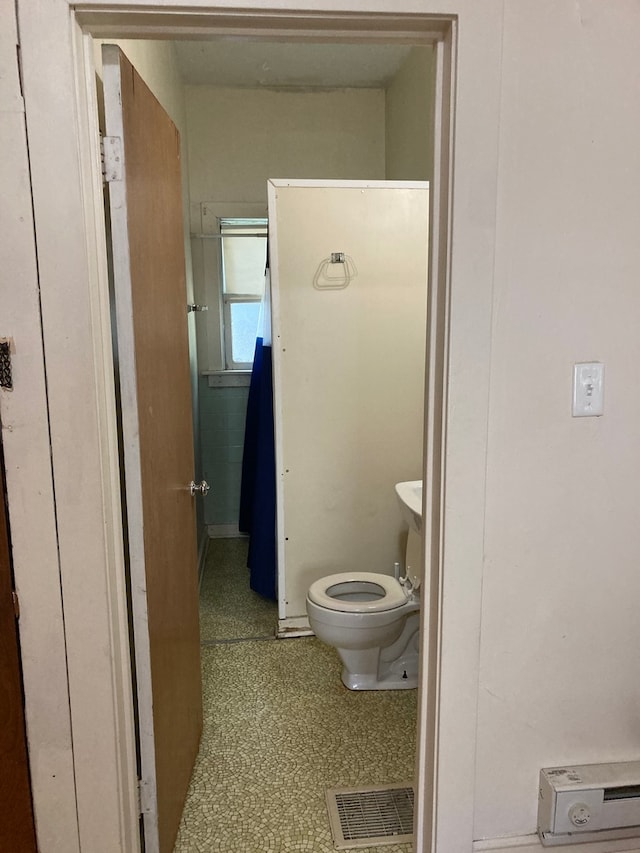 bathroom featuring toilet