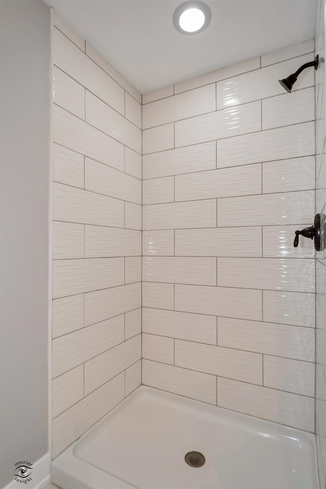 bathroom with a tile shower