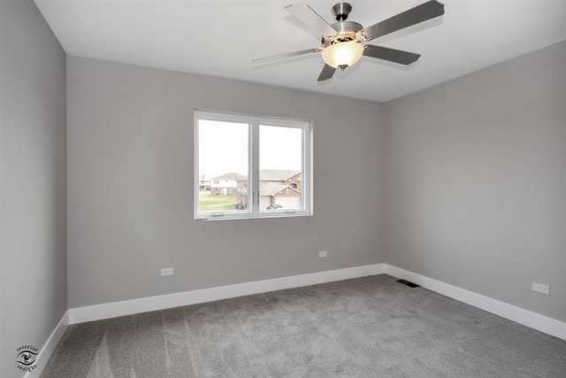 spare room featuring ceiling fan and light colored carpet